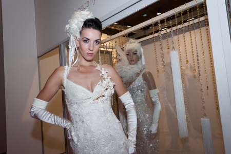 MILAN, ITALY - JUNE 21: People visit SposaItalia exhibition, international presentation of bridal and formal wear according to Italian style in Milan on JUNE 21, 2013.のeditorial素材