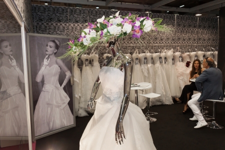 MILAN, ITALY - JUNE 21: People visit SposaItalia exhibition, international presentation of bridal and formal wear according to Italian style in Milan on JUNE 21, 2013.のeditorial素材