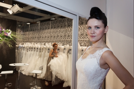 MILAN, ITALY - JUNE 21: People visit SposaItalia exhibition, international presentation of bridal and formal wear according to Italian style in Milan on JUNE 21, 2013.のeditorial素材