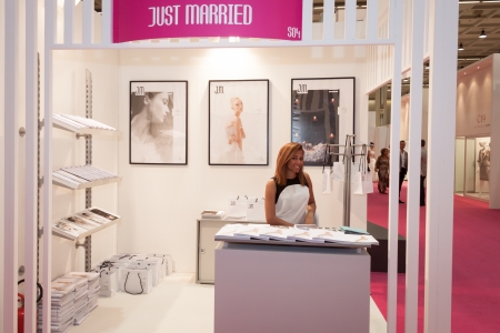 MILAN, ITALY - JUNE 21: People visit SposaItalia exhibition, international presentation of bridal and formal wear according to Italian style in Milan on JUNE 21, 2013.のeditorial素材