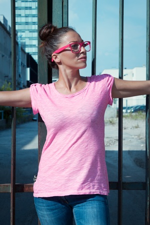 Portrait of a beautiful girl wearing pink glassesの写真素材