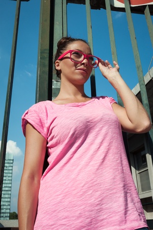Portrait of a beautiful girl wearing pink glassesの写真素材