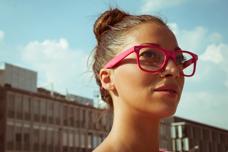 Portrait of a beautiful girl with pink glassesの写真素材