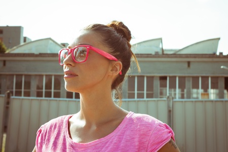 Portrait of a beautiful girl with pink glassesの写真素材