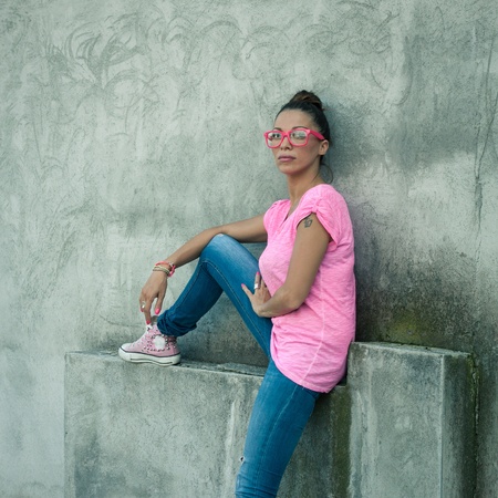 Portrait of a beautiful girl with pink glassesの写真素材