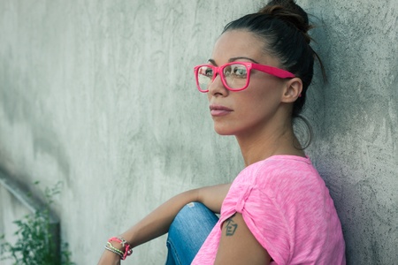 Portrait of a beautiful girl with pink glassesの写真素材
