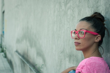 Portrait of a beautiful girl with pink glassesの写真素材