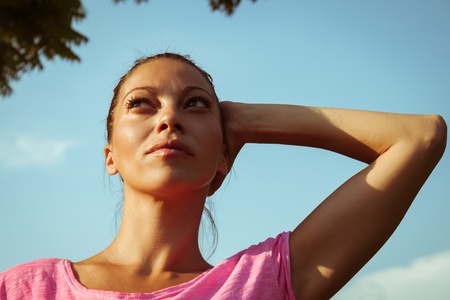 Portrait of a beautiful girl with casual look against blue skyの写真素材