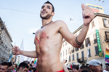 MILAN, ITALY - JUNE 29: Thousands of people march in the city streets for the annual gay pride parade, claiming equality and legal rights in Milan on JUNE 29, 2013のeditorial素材