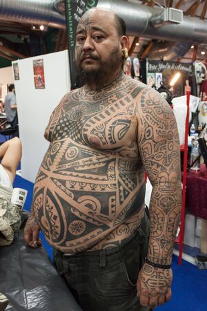 MILAN, ITALY - JUlY 6: People visit Tatuami, important event dedicated to the world of tattoos in Milan on JUlY 6, 2013のeditorial素材