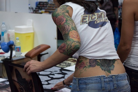 MILAN, ITALY - JUlY 6: People visit Tatuami, important event dedicated to the world of tattoos in Milan on JUlY 6, 2013のeditorial素材
