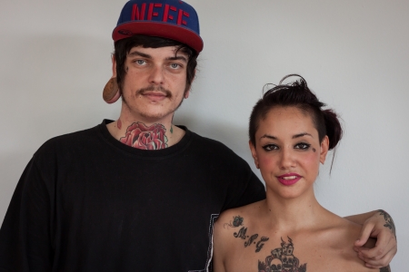 MILAN, ITALY - JUlY 6: Portrait of a young couple at Tatuami, important event dedicated to the world of tattoos in Milan on JUlY 6, 2013のeditorial素材