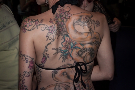 MILAN, ITALY - JUlY 6: People visit Tatuami, important event dedicated to the world of tattoos in Milan on JUlY 6, 2013のeditorial素材