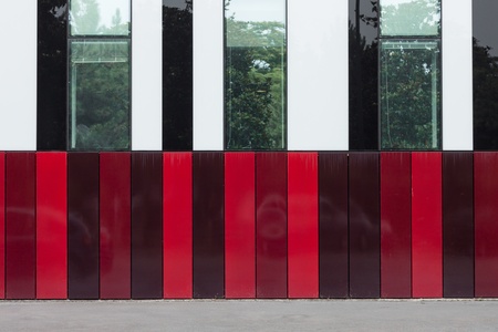 Architectural detail of modern building with red stripesの写真素材