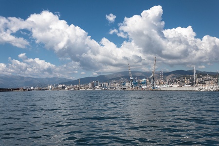 Big white clouds over the port of Genoa, Italyの写真素材