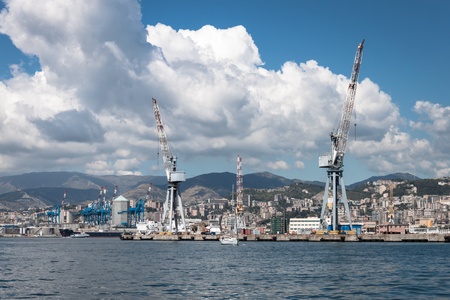 Big white clouds over the port of Genoa, Italyの写真素材