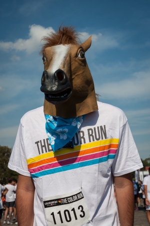 MILAN, ITALY - SEPTEMBER 7  A horseman takes part in The Color Run event, the funniest and most colorful urban running ever where participants become targets for multicolor powders thrown by organization in Milan on September 7, 2013のeditorial素材