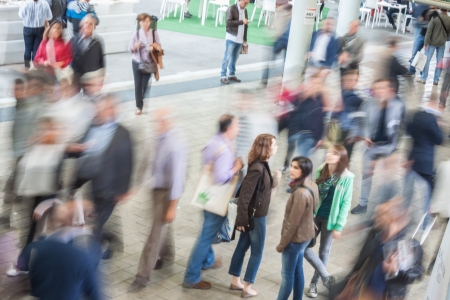 MILAN, ITALY - OCTOBER 3  Blur effect of people walking and visiting Made expo, international architecture and building trade show on October 3, 2013 in Milan のeditorial素材
