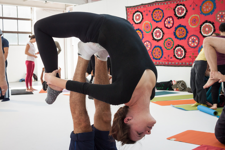 MILAN, ITALY - OCTOBER 11  People take a class at Yoga Festival 2013, event dedicated to yoga, meditation and healthy lifestyle on OCTOBER 11, 2013 in Milan のeditorial素材