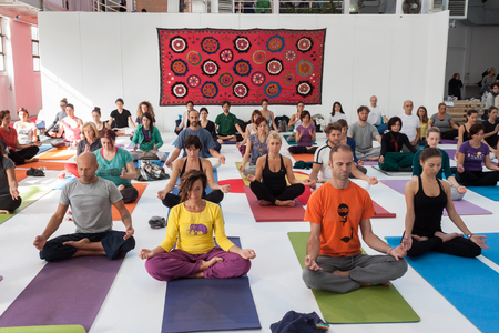 MILAN, ITALY - OCTOBER 11  People take a class at Yoga Festival 2013, event dedicated to yoga, meditation and healthy lifestyle on OCTOBER 11, 2013 in Milan のeditorial素材