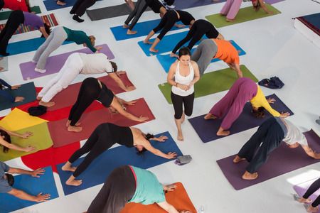 MILAN, ITALY - OCTOBER 11  People take a class at Yoga Festival 2013, event dedicated to yoga, meditation and healthy lifestyle on OCTOBER 11, 2013 in Milan のeditorial素材