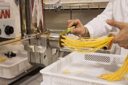 MILAN, ITALY - OCTOBER 18  Pasta machine at Host 2013, international exhibition of the hospitality industry on OCTOBER 18, 2013 in Milan のeditorial素材