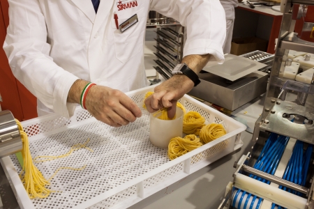MILAN, ITALY - OCTOBER 18  Handmade egg pasta at Host 2013, international exhibition of the hospitality industry on OCTOBER 18, 2013 in Milan のeditorial素材