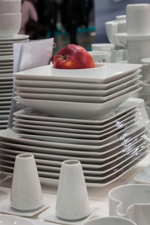 MILAN, ITALY - OCTOBER 18  Tableware with red apple Host 2013, international exhibition of the hospitality industry on OCTOBER 18, 2013 in Milan のeditorial素材