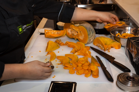 MILAN, ITALY - NOVEMBER 16: Pumpkin cut into round pieces at Golosaria, important event dedicated to culture and tradition of quality food and wine on NOVEMBER 16, 2013 in Milan.のeditorial素材