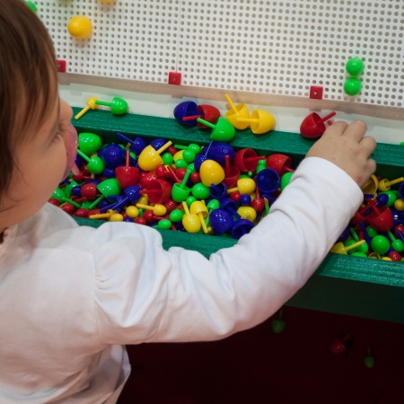 MILAN, ITALY - NOVEMBER 22  Child plays at G  come giocare, trade fair dedicated to games, toys and children on NOVEMBER 22, 2013 in Milan のeditorial素材