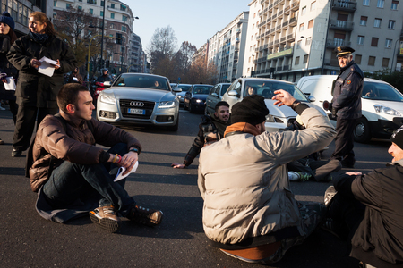 MILAN, ITALY - DECEMBER 10: Demonstrators occupy the city streets blocking the traffic to protest against government and politicians on DECEMBER 10, 2013 in Milan.のeditorial素材