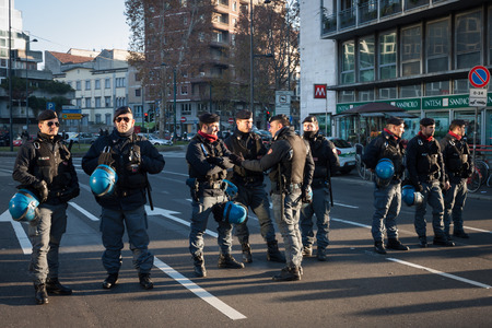 MILAN, ITALY - DECEMBER 13: Riot police waits for demonstrators protesting against government and politicians on DECEMBER 13, 2013 in Milan.のeditorial素材