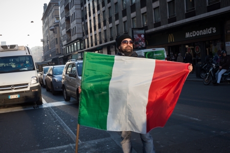 MILAN, ITALY - DECEMBER 13: Demonstrators occupy the city streets blocking the traffic to protest against government and politicians on DECEMBER 13, 2013 in Milan.のeditorial素材