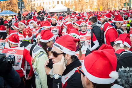 MILAN, ITALY - DECEMBER 14  Almost 10 000 Santas take part in the Babbo Running, colorful and funny event to celebrate this coming Christmas on DECEMBER 14, 2013 in Milan のeditorial素材