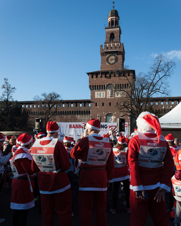 MILAN, ITALY - DECEMBER 14  Almost 10 000 Santas take part in the Babbo Running, colorful and funny event to celebrate this coming Christmas on DECEMBER 14, 2013 in Milan のeditorial素材