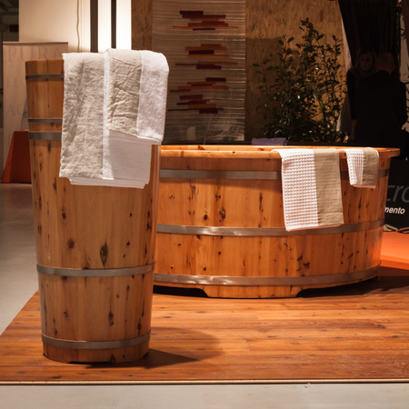 MILAN, ITALY - FEBRUARY 7: Wooden bath tub on display at Olis Festival, event dedicated to holistic disciplines, alternative medicine and natural food on FEBRUARY 7, 2014 in Milan.のeditorial素材