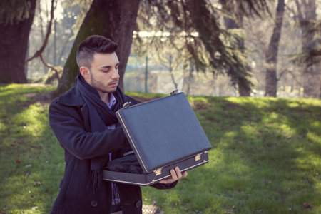 Portrait of a handsome young man with briefcase