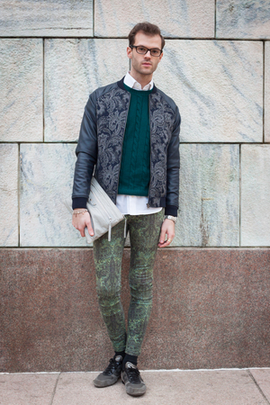 MILAN, ITALY - FEBRUARY 20: People gathers outside the fashion shows buildings for Milan Women's Fashion Week on FEBRUARY 20, 2014 in Milan.のeditorial素材