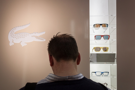 MILAN, ITALY - MARCH 1: People visit Mido, international exhibition for optics, optometry and ophtalmology on MARCH 1, 2014 in Milan.のeditorial素材