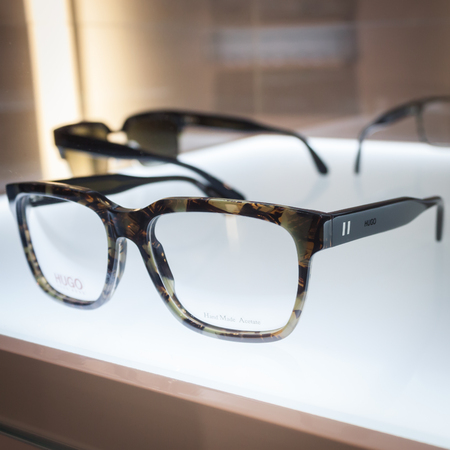 MILAN, ITALY - MARCH 1: Hugo Boss glasses on display at Mido, international exhibition for optics, optometry and ophtalmology on MARCH 1, 2014 in Milan.のeditorial素材