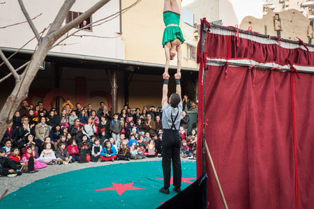 MILAN, ITALY - MARCH 7: Artists perform in their acrobatic show at Milan Clown Festival, international event dedicated to clowns and street theatre on MARCH 7, 2014 in Milan.のeditorial素材
