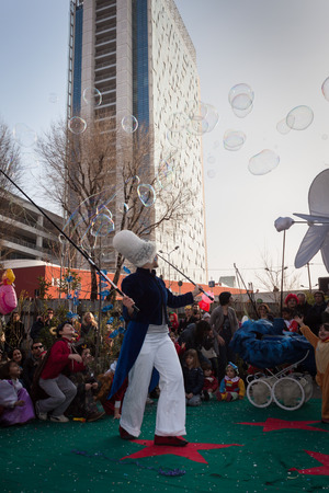 MILAN, ITALY - MARCH 8: Artist creates giant soap bubbles at Milan Clown Festival, international event dedicated to clowns and street theatre on MARCH 8, 2014 in Milan.のeditorial素材