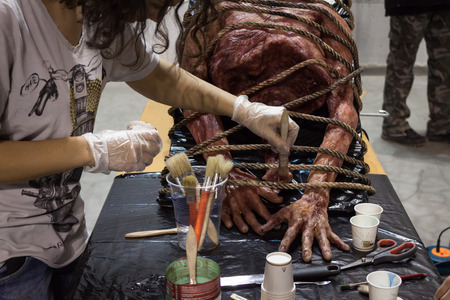 MILAN, ITALY - MARCH 14: Work in progress on a latex corpse at Cartoomics, event dedicated to comics, cartoons, cosplay, fantasy and gaming on MARCH 14, 2014 in Milanのeditorial素材