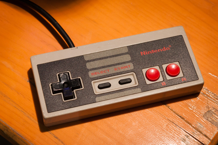 MILAN, ITALY - MARCH 14: Vintage Nintendo controller at Cartoomics, event dedicated to comics, cartoons, cosplay, fantasy and gaming on MARCH 14, 2014 in Milanのeditorial素材