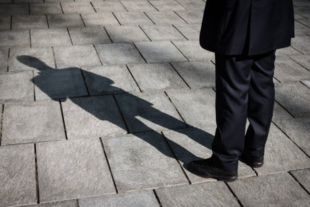 Floor with shadow of a businessman standingの写真素材