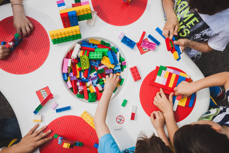 MILAN, ITALY - MAY 10: Children play at Lego Village, event held in the city streets to promote creativity and manual ability on MAY 10, 2014 in Milan.のeditorial素材