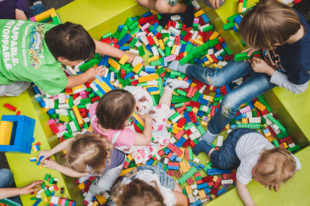 MILAN, ITALY - MAY 10: Children play at Lego Village, event held in the city streets to promote creativity and manual ability on MAY 10, 2014 in Milan.のeditorial素材