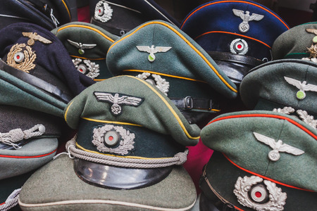 MILAN, ITALY - MAY 18: Wehrmacht visor caps on display at Militalia, exhibition dedicated to militaria collectors and military associations on MAY 18, 2014 in Milan.のeditorial素材