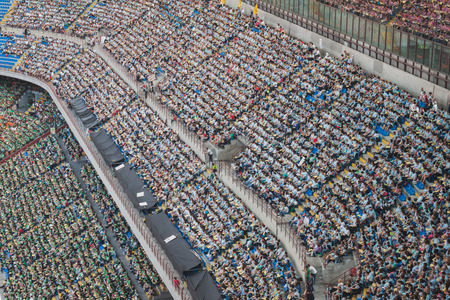 MILAN, ITALY - JUNE 2: 50.000 teenagers take part in a ceremony at San Siro stadium where archbishop Scola meets them before they receive the sacrament of Confirmation on JUNE 2, 2014 in Milan.のeditorial素材