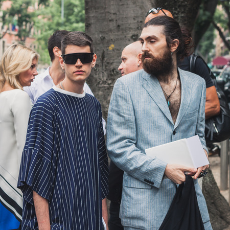 MILAN, ITALY - JUNE 23  People gather outside Armani fashion shows building for Milan Men Fashion Week on JUNE 23, 2014 in Milan のeditorial素材